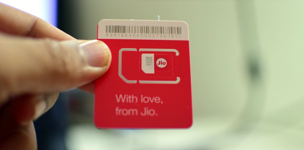 Jio Red Sim Card in Hand