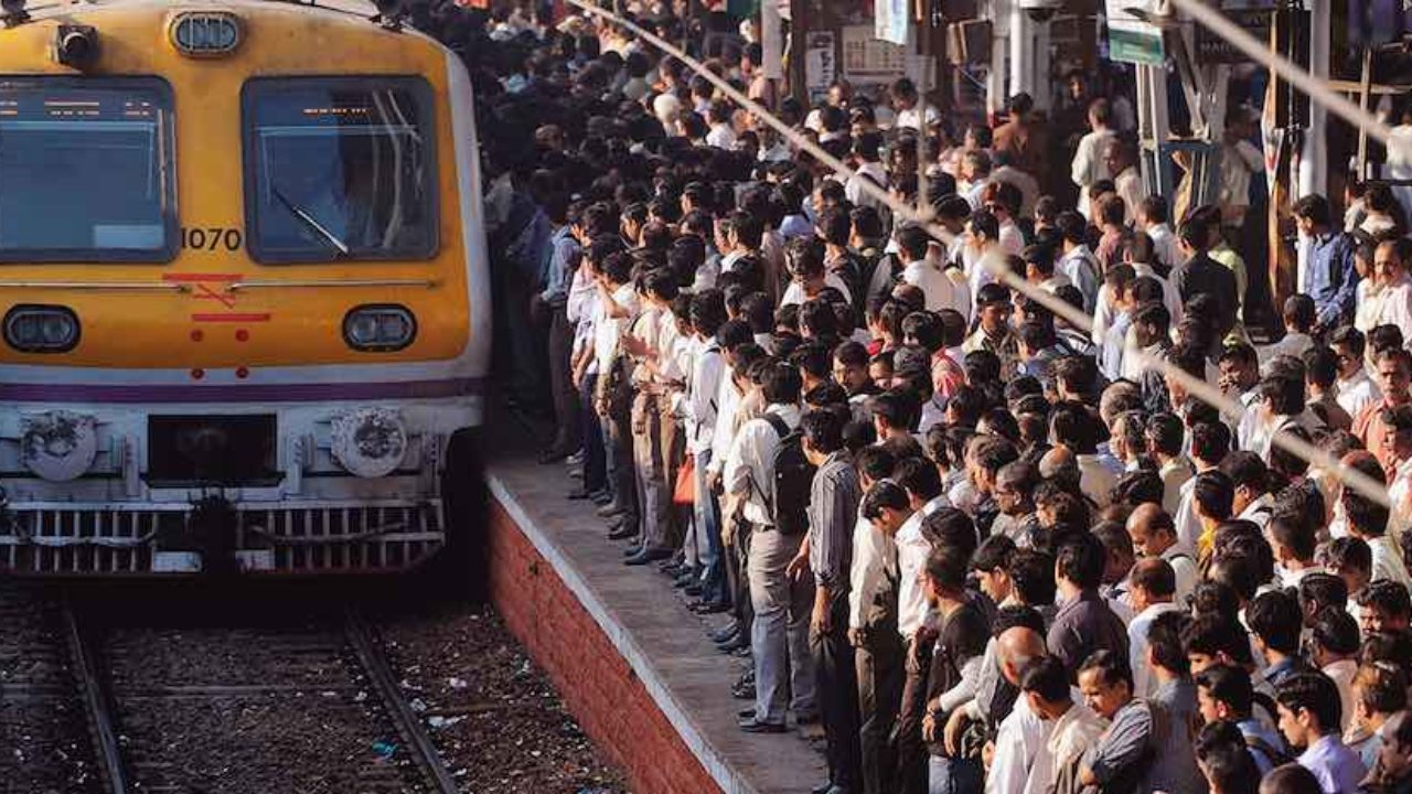 A rush hour crowd wait for their train in a railway station