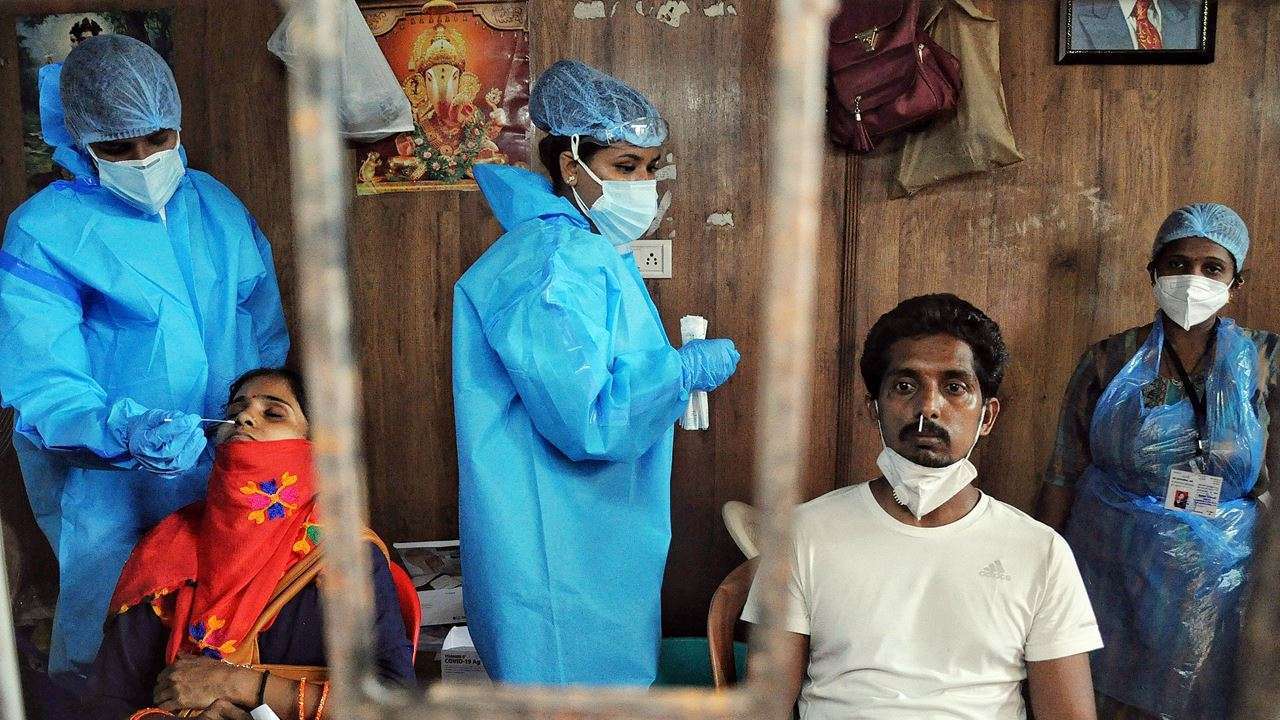 Health worker conducting Covid test in a rural area