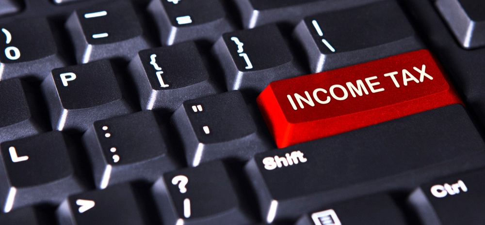 graphic of a red key on a keyboard named "income tax"