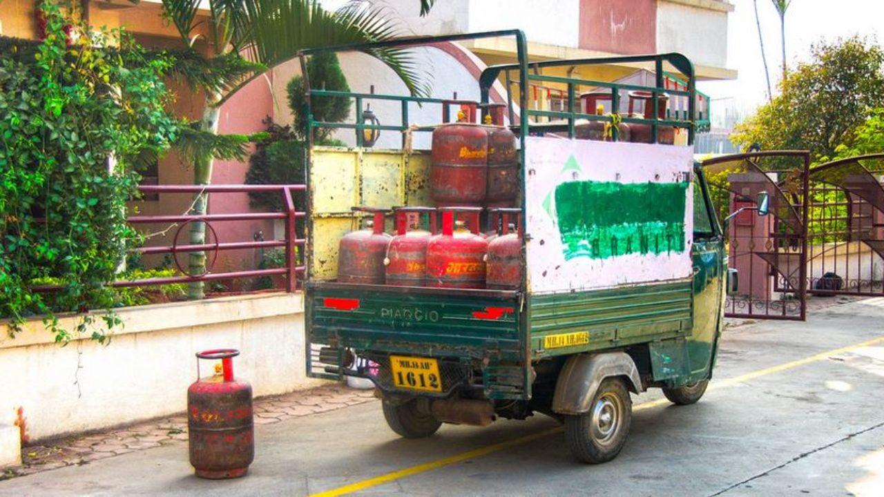A transport van carrying LPG cylinders parked on a road