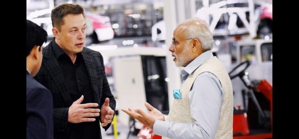 Elon Musk conversing with PM Modi