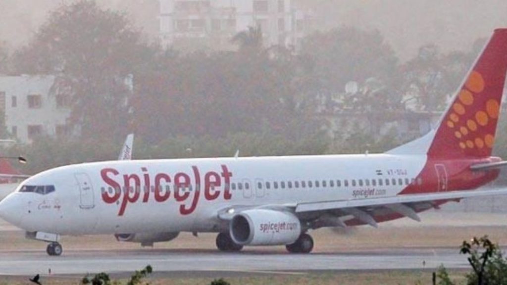 A Spicejet branded airplane parked on tarmac