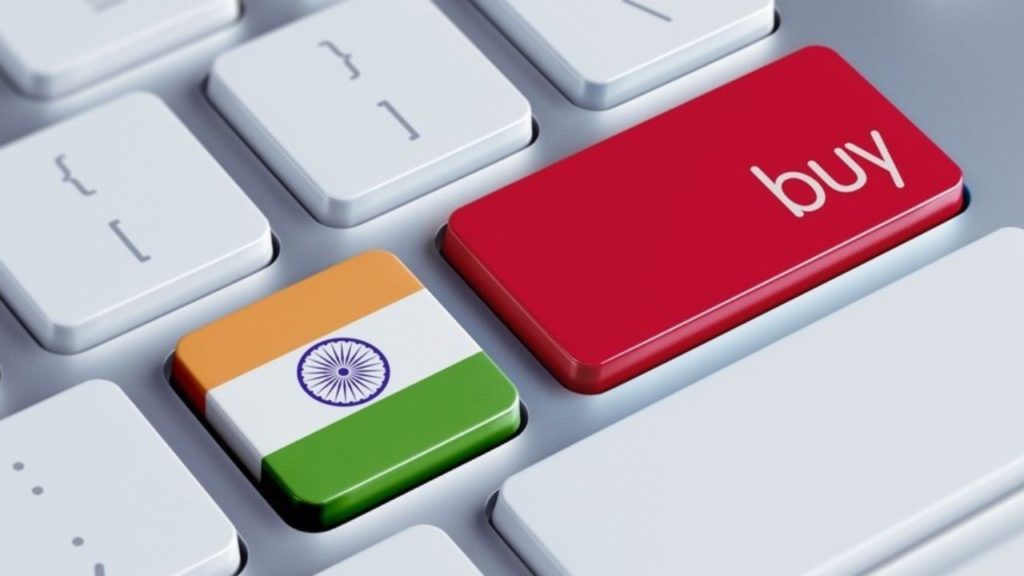 Two keys on a keyboard with one having the Indian flag and the other saying "Buy"