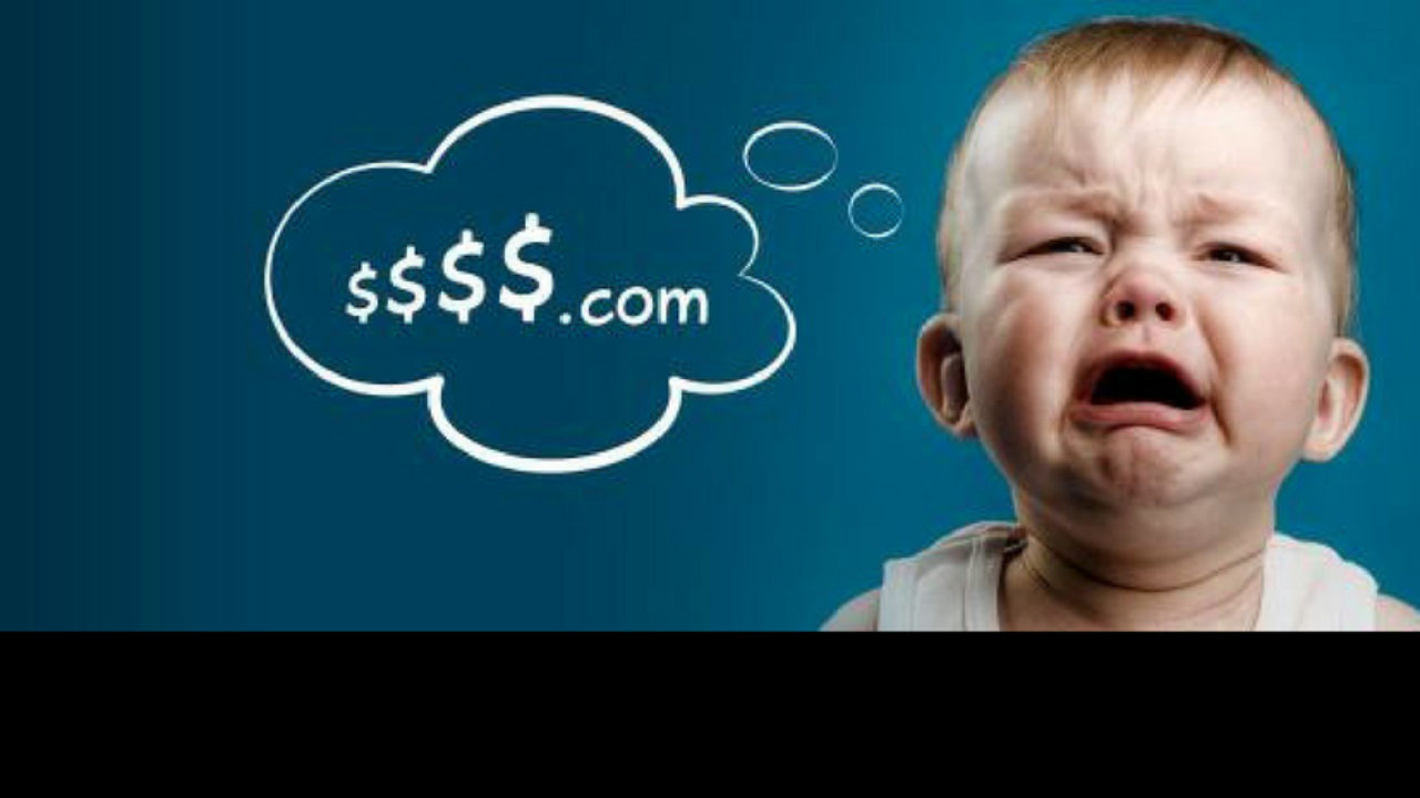 Image depicting a crying baby with a thought bubble reading '$$$$.com'